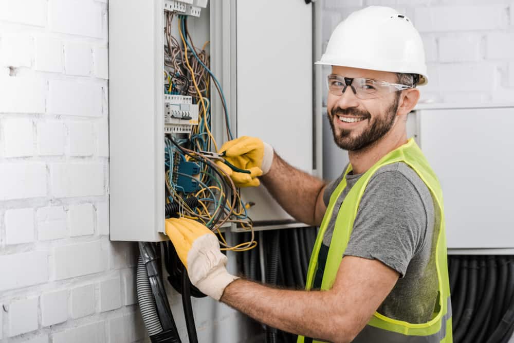 electrician smiling while working